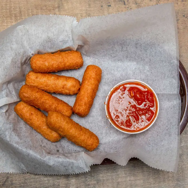 Breaded mozzarella sticks with marinara sauce